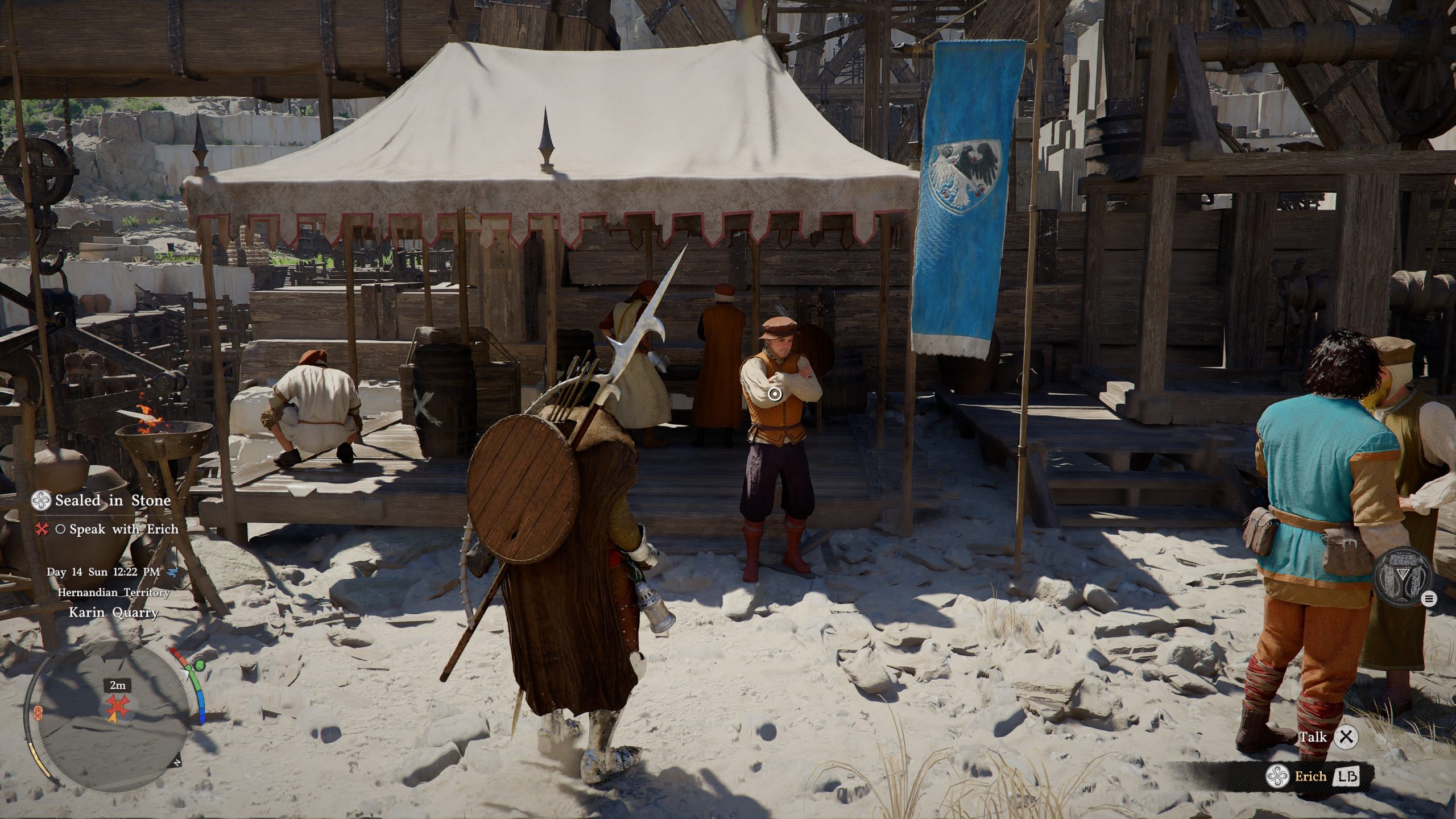 A character in a medieval setting of Crimson Desert stands in front of a tent in Karin Quarry, with a prompt to 'Speak with Erich' visible on the screen.
