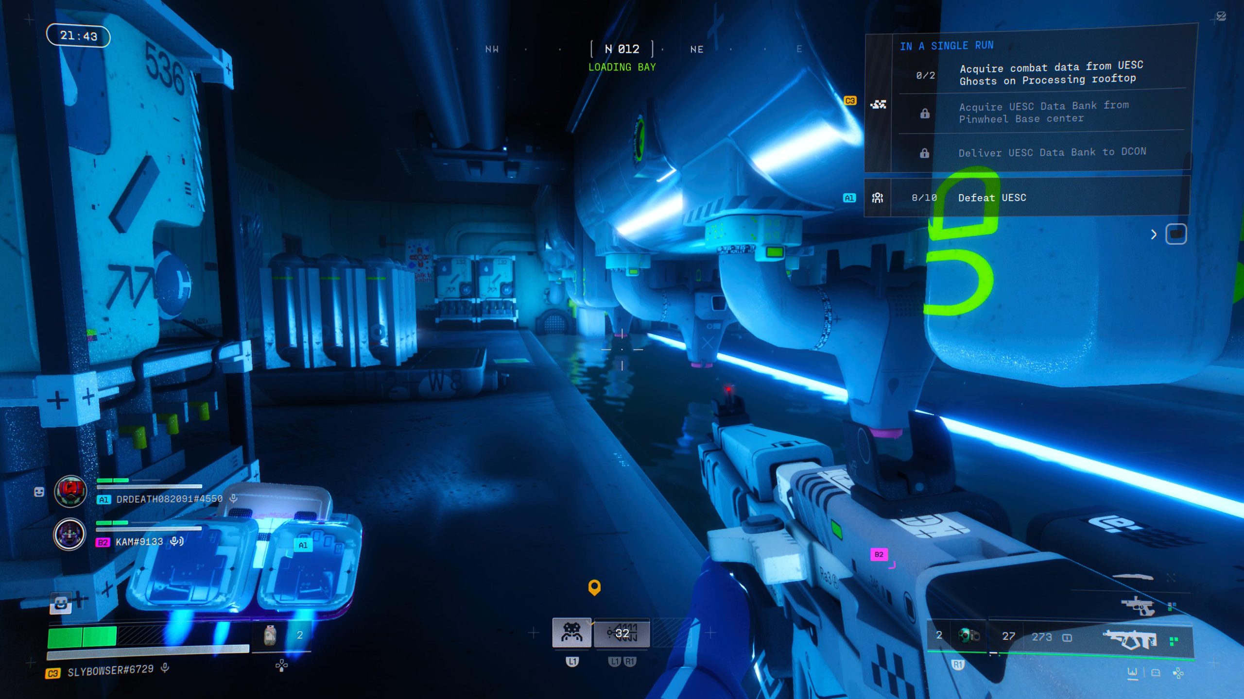 A first-person shooter game screen shows a futuristic gun in a dimly lit loading bay with objectives listed on-screen including 'Acquire combat data from UESC Ghosts on Processing rooftop.'