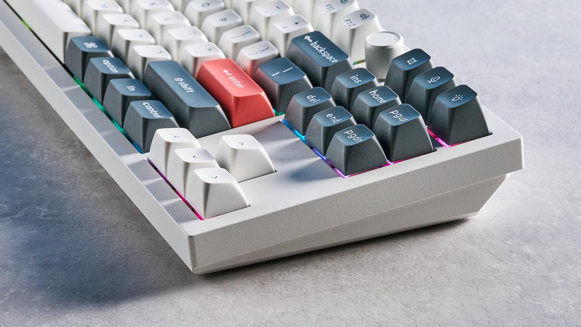 Keychron Q3 Ultra 8K photographed on a grey table in front of a blue background